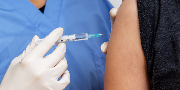doctor-vaccinating-person-against-virus-in-close-u-2021-09-01-16-08-20-utc