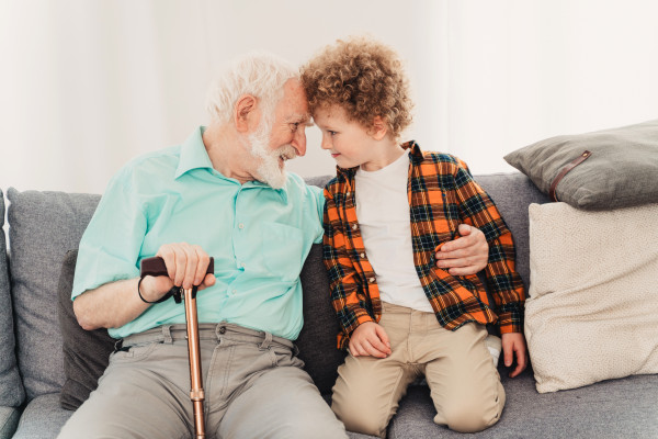 grandparents-and-grandson-playing-at-home-T7K2XJV